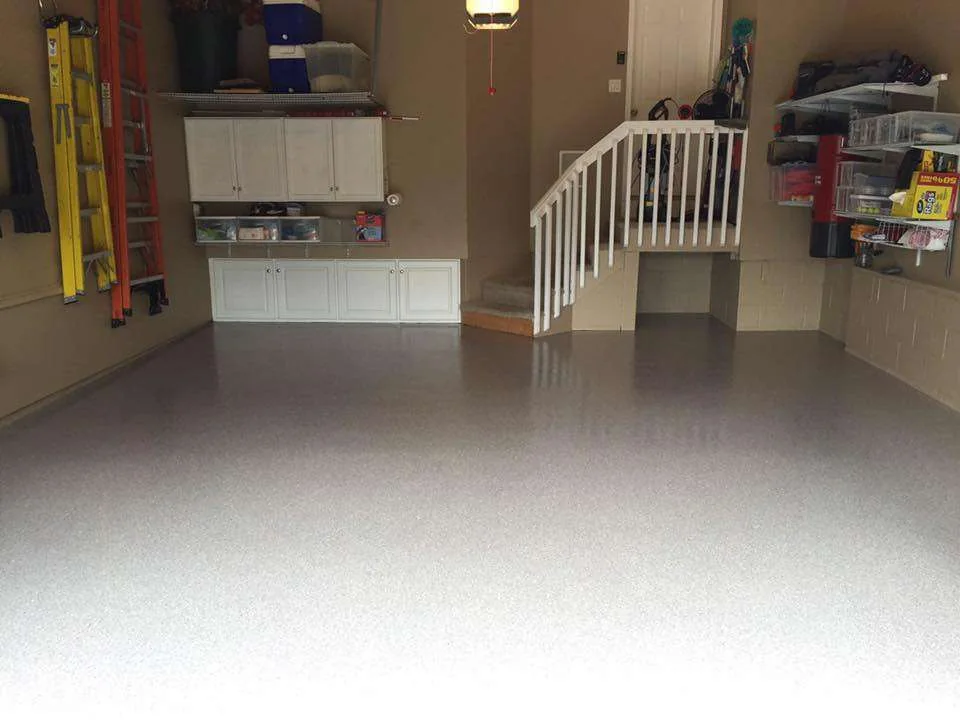 After: the same garage with a smooth flake floor coating.
