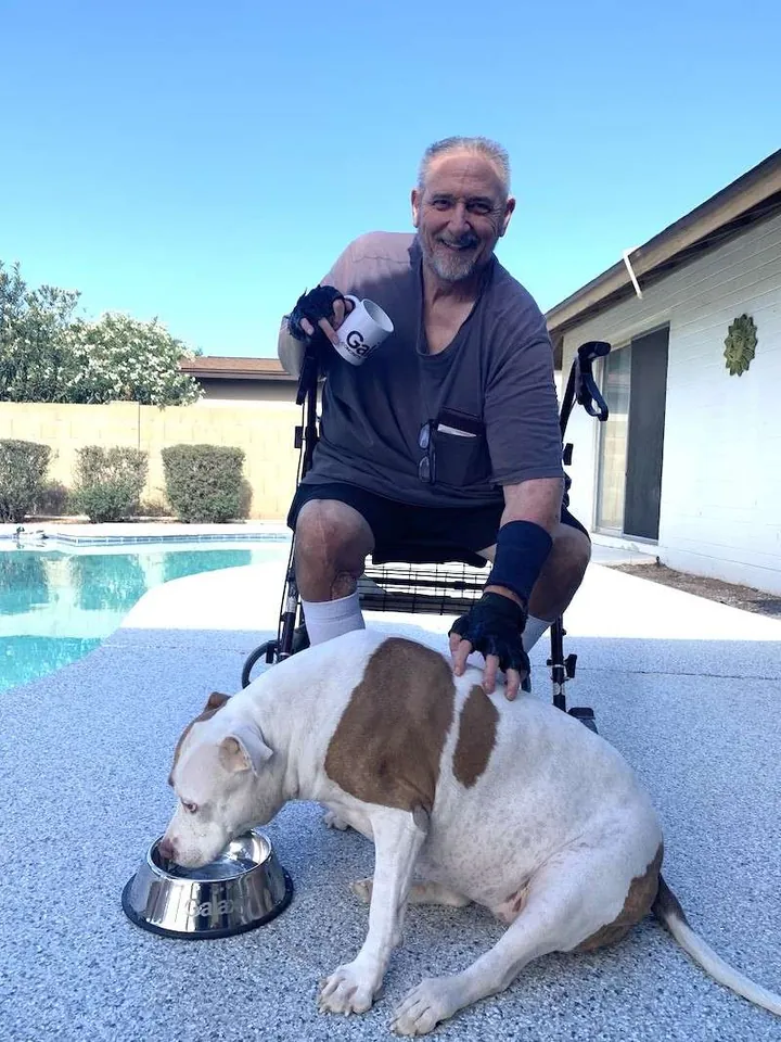 Homeowner with his dog beside a pool on a newly coated deck.